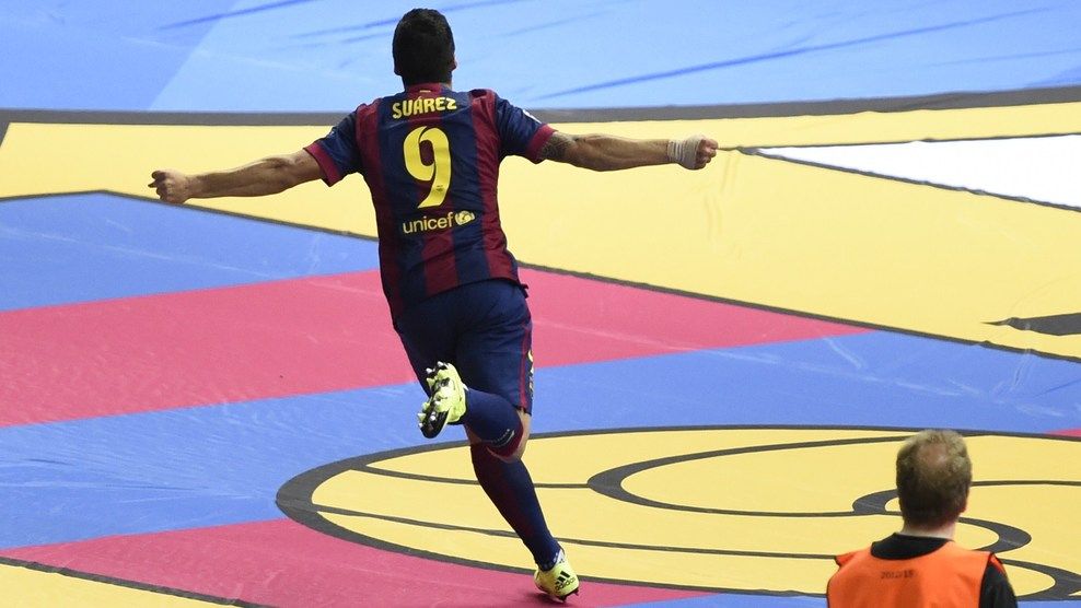 Barcelona's Uruguayan forward Luis Suarez celebrates after scoring the 1-2 during the UEFA Champions League Final football match between Juventus and FC Barcelona at the Olympic Stadium in Berlin on June 6, 2015.     AFP PHOTO / ODD ANDERSEN        (Photo credit should read ODD ANDERSEN/AFP/Getty Images)