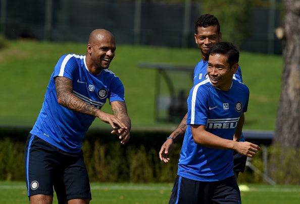 COMO, ITALY - SEPTEMBER 18:   Felipe Melo (L) and Yuto Nagatomo of FC Internazionale smile during a training session at the club's training ground at Appiano Gentile on September 18, 2015 in Como, Italy.  (Photo by Claudio Villa - Inter/Inter via Getty Images)