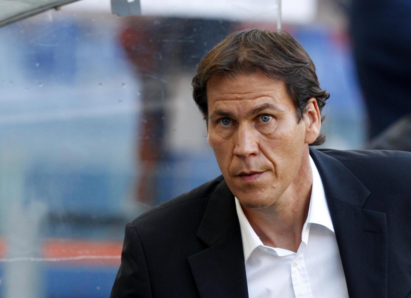 AS Roma coach Rudi Garcia, of France, waits for the kick-off of a Serie A soccer match between AS Roma and Hellas Verona, at Rome's Olympic stadium, Sunday, Sept. 1, 2013. (AP Photo/Riccardo De Luca)