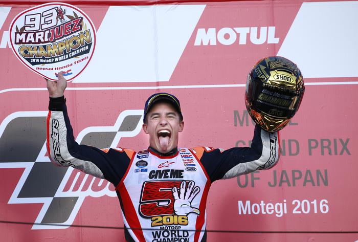 Spain's Marc Marquez celebrates during the awarding ceremony of the MotoGP Japanese Motorcycle Grand Prix at the Twin Ring Motegi circuit in Motegi, north of Tokyo, Sunday, Oct. 16, 2016. Marquez won the MotoGP of Japan on Sunday to secure the 2016 title with three races remaining. (ANSA/AP Photo/Shizuo Kambayashi) [CopyrightNotice: Copyright 2016 The Associated Press. All rights reserved.]