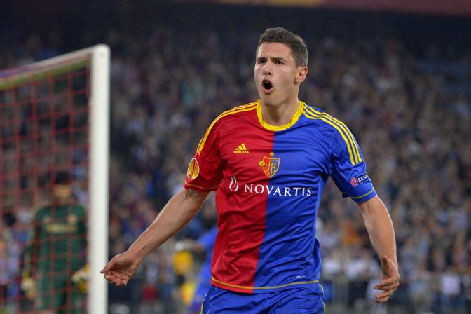 FC Basel's defender Fabian Schaer celebrates after scoring a penalty kick during an UEFA Europa League first leg semi-final football match between Basel and Chelsea at the St Jakob stadium in Basel on April 25, 2013.  AFP PHOTO / FABRICE COFFRINI