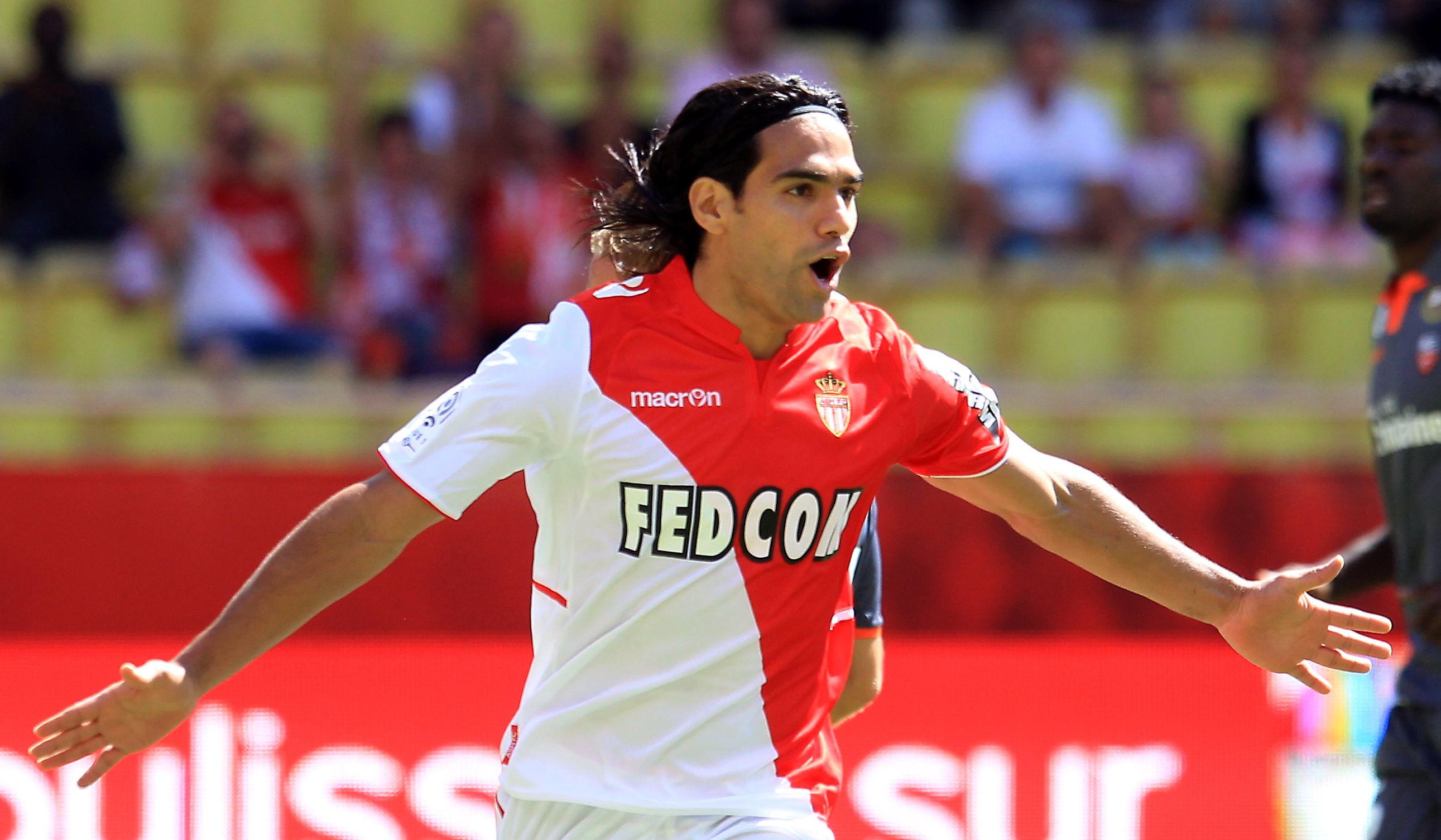 Monaco's Colombian forward Radamel Falcao celebrates after scoring a goal from the penalty spot during the French L1 football match between AS Monaco and FC Lorient at the Louis II Stadium in Monaco on September 15, 2013. AFP PHOTO / JEAN CHRISTOPHE MAGNENET