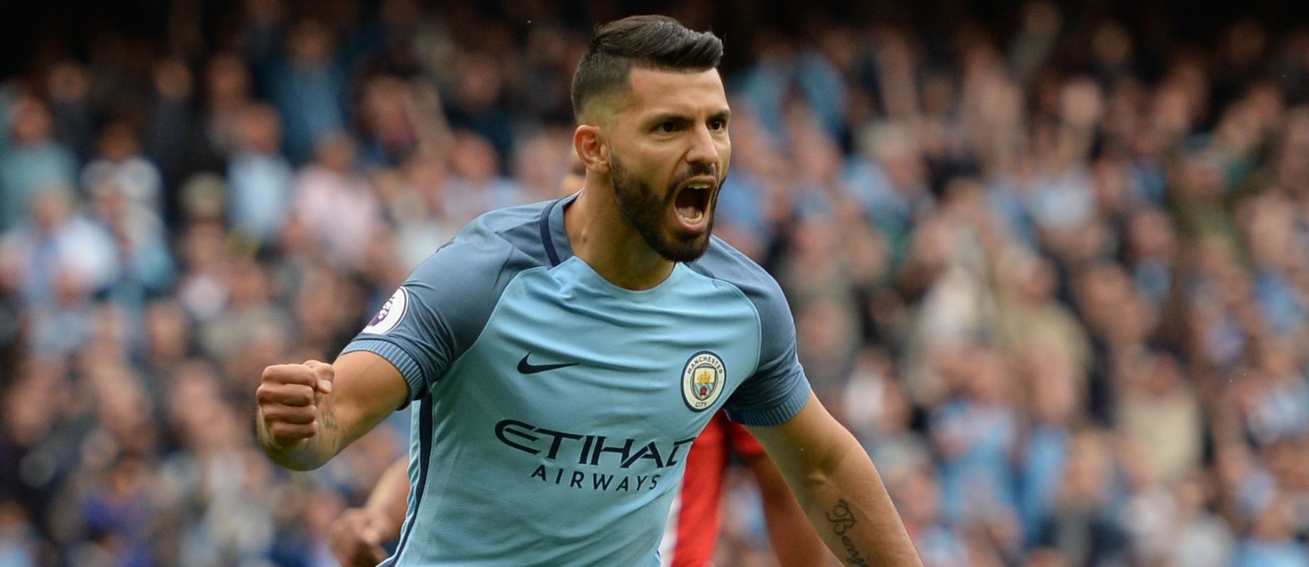 Manchester City's Argentinian striker Sergio Aguero celebrates scoring the opening goal from the penalty spot during the English Premier League football match between Manchester City and Sunderland at the Etihad Stadium in Manchester, north west England, on August 13, 2016. / AFP / OLI SCARFF / RESTRICTED TO EDITORIAL USE. No use with unauthorized audio, video, data, fixture lists, club/league logos or 'live' services. Online in-match use limited to 75 images, no video emulation. No use in betting, games or single club/league/player publications. / (Photo credit should read OLI SCARFF/AFP/Getty Images)