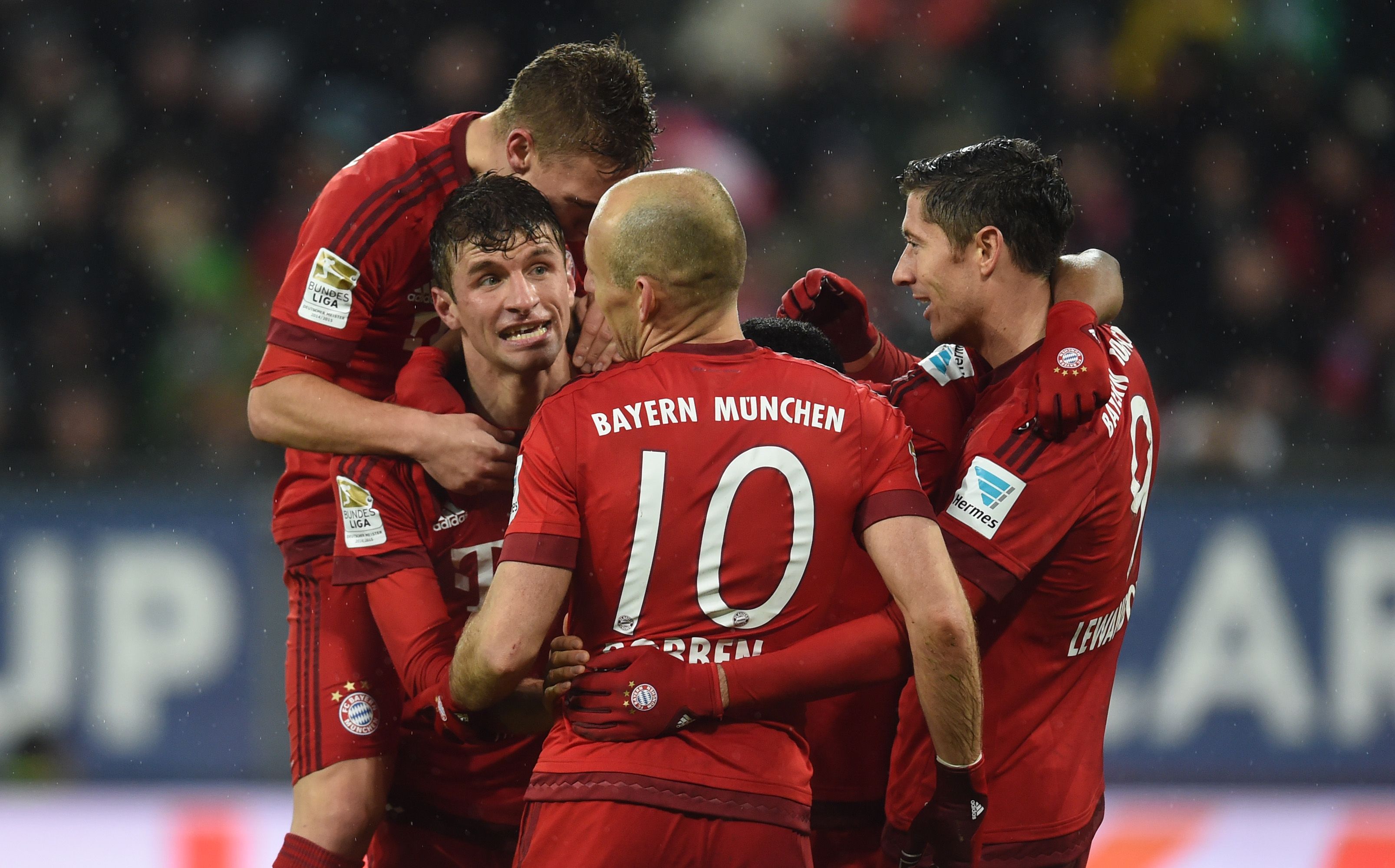 (L-R) Bayern Munich's midfielder Joshua Kimmich, Bayern Munich's striker Thomas Mueller, Bayern Munich's Dutch midfielder Arjen Robben and Bayern Munich's Polish striker Robert Lewandowski celebrate after the third goal for Munich during the German first division Bundesliga football match of FC Augsburg vs FC Bayern Munich in Augsburg, southern Germany, on February 14, 2016. / AFP / CHRISTOF STACHE / RESTRICTIONS: DURING MATCH TIME: DFL RULES TO LIMIT THE ONLINE USAGE TO 15 PICTURES PER MATCH AND FORBID IMAGE SEQUENCES TO SIMULATE VIDEO. == RESTRICTED TO EDITORIAL USE == FOR FURTHER QUERIES PLEASE CONTACT DFL DIRECTLY AT + 49 69 650050         (Photo credit should read CHRISTOF STACHE/AFP/Getty Images)