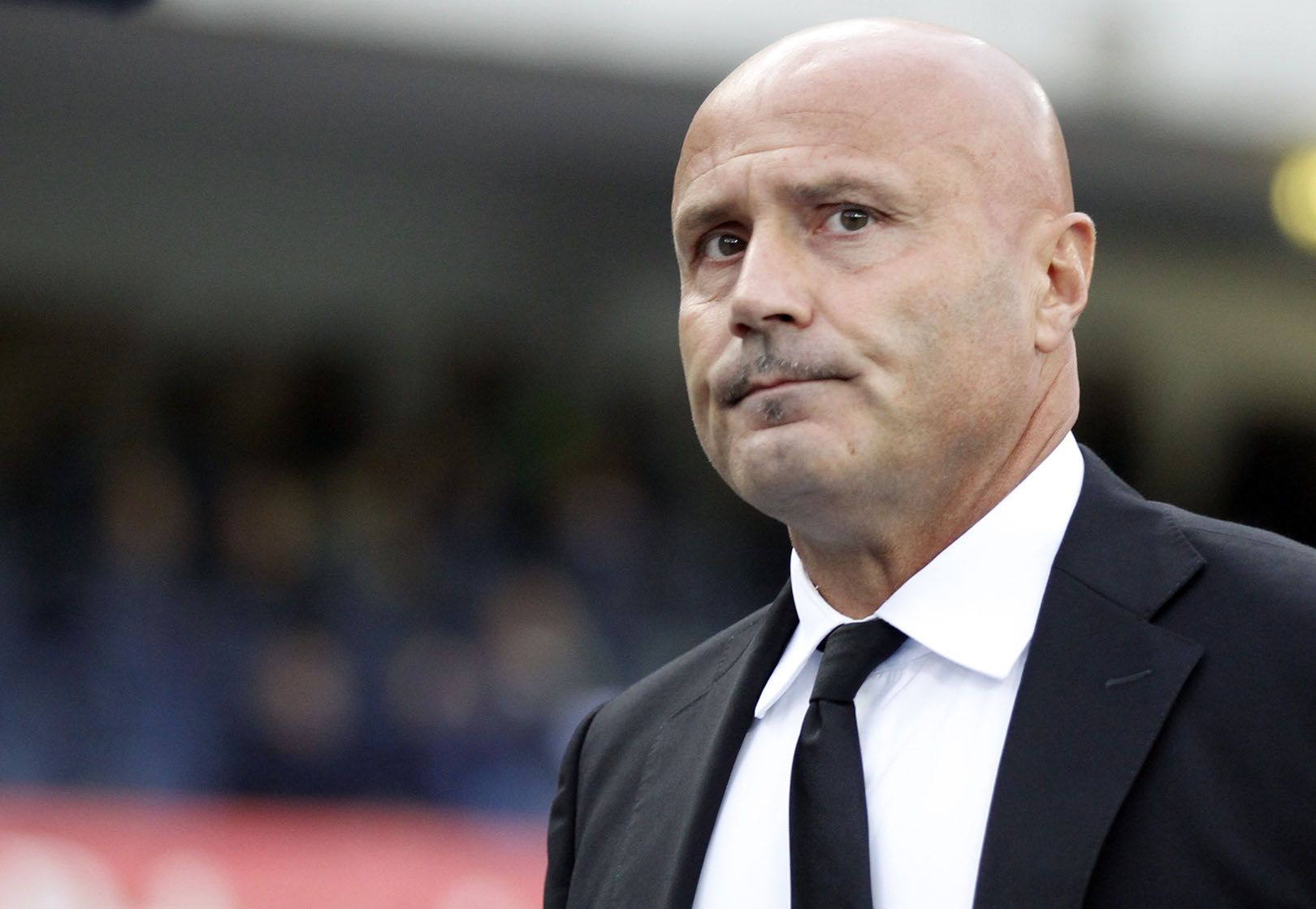 Atalanta's coach Stefano Colantuono waits for the start of a Serie A soccer match against Chievo at Bentegodi stadium in Verona, Italy, Saturday, Oct. 5, 2013. (AP Photo/Felice Calabro')