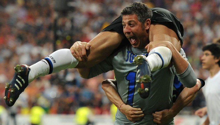Inter Milan's goalkeeper Francesco Toldo and Inter Milan's Argentinian defender and captain Javier Aldemar Zanetti (up) celebrate after winning the UEFA Champions League final football match Inter Milan against Bayern Munich at the Santiago Bernabeu stadium in Madrid on May 22, 2010. Inter Milan won the Champions League with a 2-0 victory over Bayern Munich in the final at the Santiago Bernabeu. Argentine striker Diego Milito scored both goals for Jose Mourinho's team who completed a treble of trophies this season.  AFP PHOTO / CHRISTOPHE SIMON (Photo credit should read CHRISTOPHE SIMON/AFP/Getty Images)