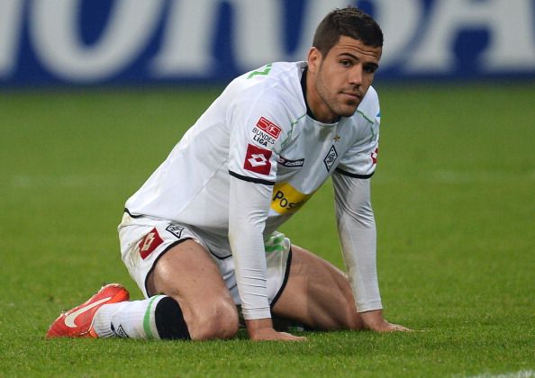 Moenchengladbach's Spanish defender Alvaro Dominguez reacts during the German first division Bundesliga football match Borussia Moenchengladbach vs Schalke 04 in the German city of Moenchengladbach on May 3, 2013. AFP PHOTO / PATRIK STOLLARZ RESTRICTIONS / EMBARGO - DFL RULES TO LIMIT THE ONLINE USAGE DURING MATCH TIME TO 15 PICTURES PER MATCH. IMAGE SEQUENCES TO SIMULATE VIDEO IS NOT ALLOWED AT ANY TIME. FOR FURTHER QUERIES PLEASE CONTACT DFL DIRECTLY AT + 49 69 650050.        (Photo credit should read PATRIK STOLLARZ/AFP/Getty Images)