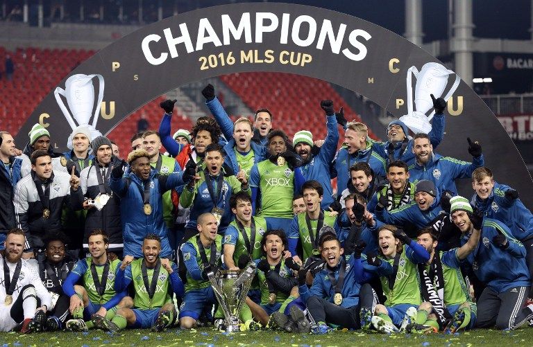Seattle Sounders celebrate their MLS Cup final victory over Toronto FC at BMO Field on December 10, 2016 in Toronto. / AFP PHOTO / Cole Burston